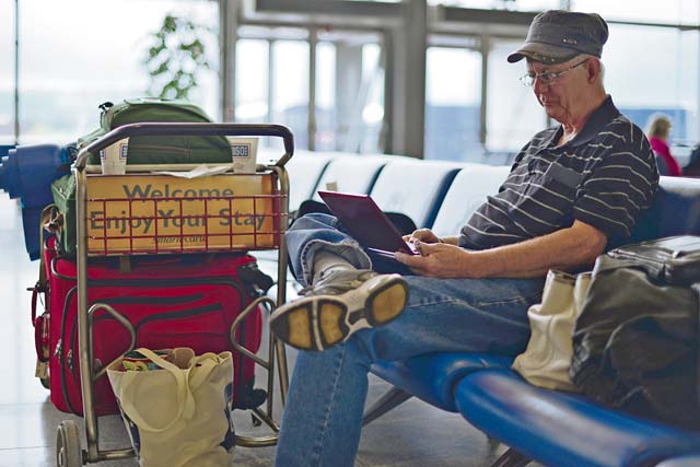 Photo by Tech. Sgt. Chad Thompson A retiree sits and waits for a Space-A flight May 10 in the Ramstein Passenger Terminal.