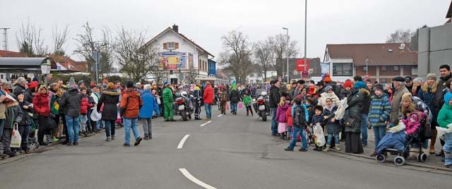 Residents line the streets Tuesday, waiting for the Fasching parade to start in Ramstein-Miesenbach. The annual parade is the largest in the Westpfalz area with more than 1,400 participants. Fasching, or Carnival as it called in some places, is a time of celebration before Lent and is customarily celebrated in Germany, Switzerland and Austria.