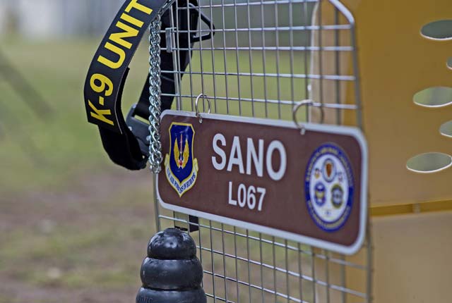 Sano, 86th Security Forces Squadron military working dog, is honored during a memorial ceremony on Ramstein. As part of the ceremony, the empty kennel where Sano once slept was placed in front of attendees. The kennel represents the life he gave to protect people and their freedom.