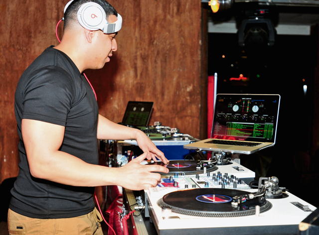 Capt. Elvis Oyola, an Airman with the 435th Contingency Response Group, competes in the “Battle of the DJs” finale Feb. 1 at the Kazabra Club.