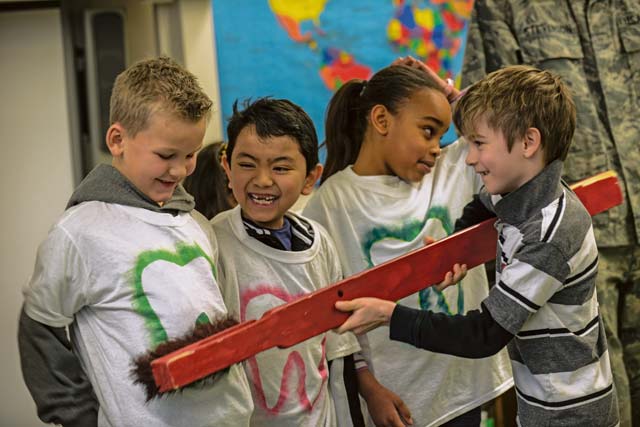 Ramstein Elemtary School students practice brushing their teeth during a dental hygiene presentation by the 86th Dental Squadron. The dental team used examples, such as flossing and brushing teeth, and talked about healthy eating and the importance of oral health care.