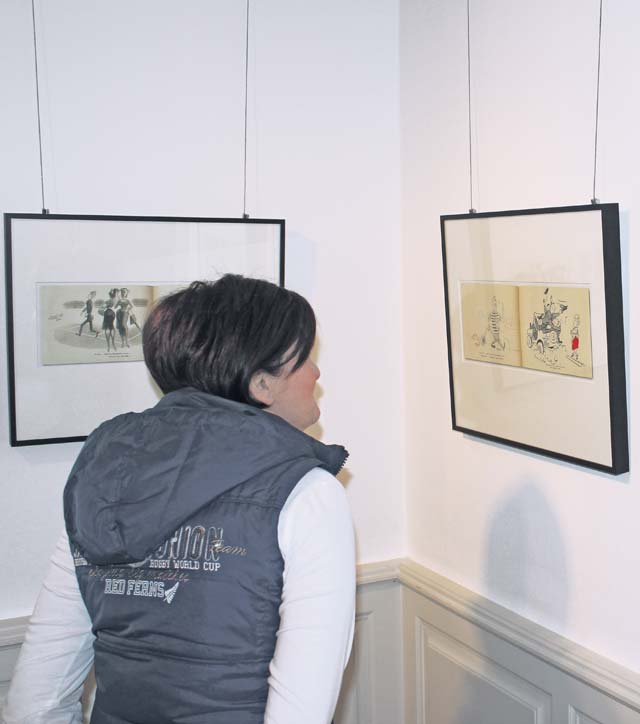 Photos by DCRVisitors of the “Americans ...” display in Ramstein-Miesenbach can admire cartoons created by Americans in the 1950s.