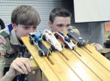 Boy Scouts Braeden Jepsen and Ty Ducheny prepare to launch four pinewood derby cars along the wooden racing course during the Pack 69 Pinewood Derby Jan. 24 at Vogelweh Elementary School.