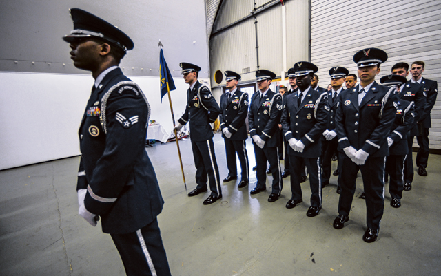 Honor guardsmen stand at parade rest during an honor guard graduation ceremony Jan. 30 on Ramstein. The Ramstein Honor Guard practices weekly to ensure they keep movements and procedures sharp for official ceremonies.