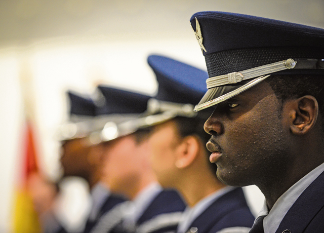 Senior Airman Richard Blackman, 569th U.S. Forces Police Squadron desk sergeant, stands at attention during the base honor guard graduation ceremony Jan. 30 on Ramstein. Trainees who sign up for the honor guard complete a week of training before participating in official functions.