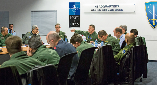 Photo by Cynthia VernatGen. Frank Gorenc (at head of table), Allied Air Command commander, leads a discussion with NATO air chiefs Feb. 5.