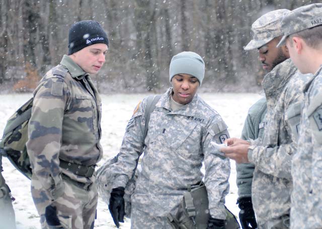 French army 2nd Lt. Vivien Mole, a cadet at the French Combined Armed School, determines his pace count prior to conducting a land navigation course Jan. 28 on Rhine Ordnance Barracks.