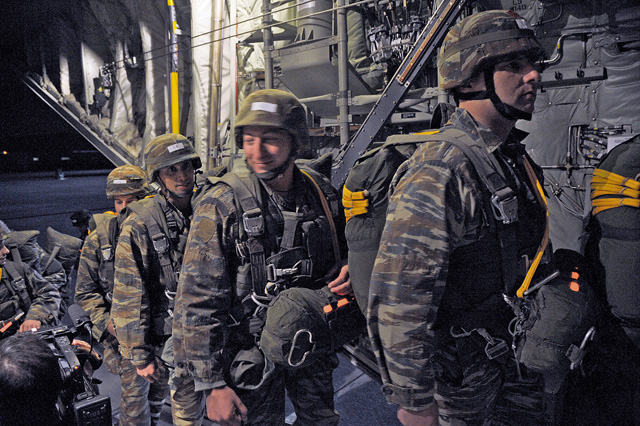 Greek paratroopers board a C-130J Super Hercules assigned to the 37th Airlift Squadron Feb. 4 during Stolen Cerberus II.