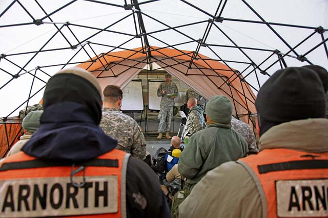 Capt. Jon Underberg, survey team leader, 773rd Civil Support Team, 7th Civil Support Command, gives an initial mission brief Feb. 6 during an Army North Training Proficiency External Evaluation of the 7th CSC’s 773rd CST’s unit readiness to respond to a real-world Chemical, Biological, Radiological or Nuclear event, Feb. 2 to 12.