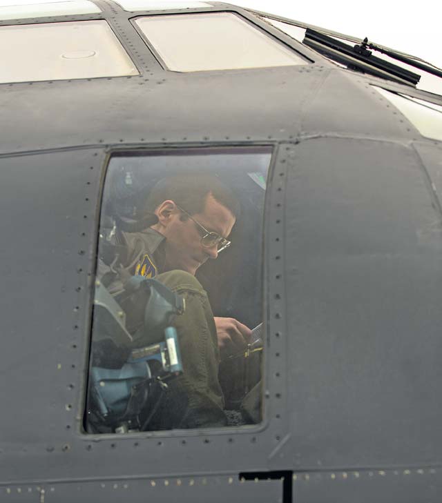 First Lt. Robert Stephenson, 37th Airlift Squadron co-pilot, prepares for a training mission in a C-130J Super Hercules Jan. 22 on Ramstein. Using its loading ramp and door, the C-130 can accommodate a wide variety of oversized cargo, including everything from utility helicopters and six-wheeled armored vehicles to standard palletized cargo and military personnel.