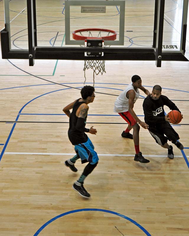 Contestants play during the 86th Airlift Wing African-American History Month Committee’s 21-point coed basketball competition Feb. 14 on Ramstein. All participants received a free T-shirt, draw-string gym bag, mini basketball and a prepaid phone card for attending.