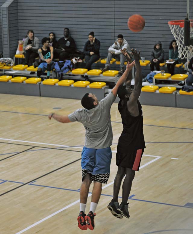 Contestants fight for a rebound during the 86th Airlift Wing African-American History Month Committee’s 21-point coed basketball competition Feb. 14 on Ramstein. This was the first year the committee held this type of event. All participants received a gift for attending.