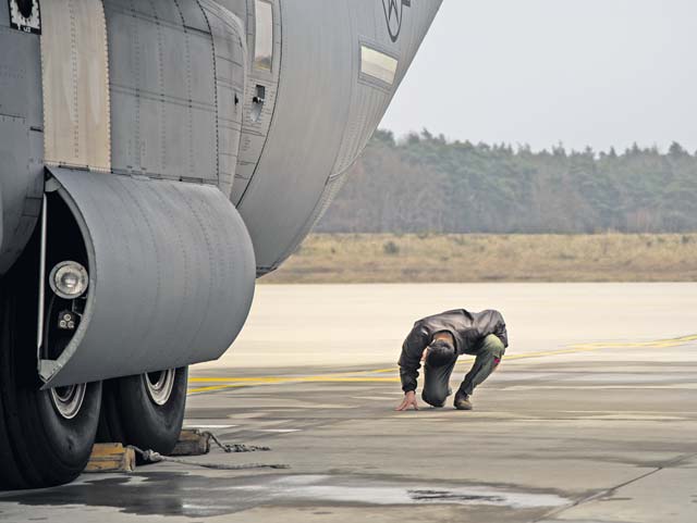 Capt. Kenneth Jubb, 37th Airlift Squadron pilot, performs pre-flight checks on a C-130J Super Hercules Jan. 22. The aircraft is capable of taking off and landing on rough dirt strips and is the prime transport for air dropping troops and equipment into hostile areas.