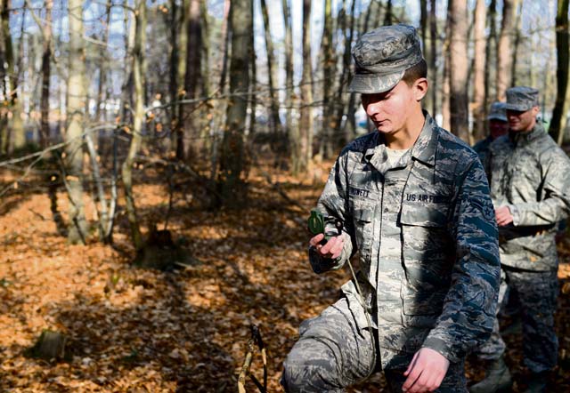 Airman 1st Class Alexander Rowett, 786th Civil Engineer Squadron heating, ventilation and air conditioning journeyman, follows his compass during a land navigation course Feb. 12 on Ramstein.