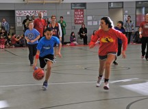 Photo by Heidi BuschStudents vs. staff basketball matchKaiserslautern Elementary School fifth-grader DeShawn Ladipo dribbles the ball past Toni Dailgle during a friendly match of basketball that set KES students against staff members. During the game, which was sponsored by the student council, the fifth-graders beat the staff 18-17 in a last-second shot.
