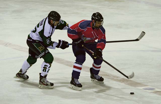 A player from the KMC Eagles 1 hockey team faces off against an opposing player during a game Feb. 25 in Viernheim, Germany. The Eagles 1 were named the 23rd annual Armed Forces Alpine Classic Division I Champions during a tournament in Garmisch-Partenkirchen, Germany.