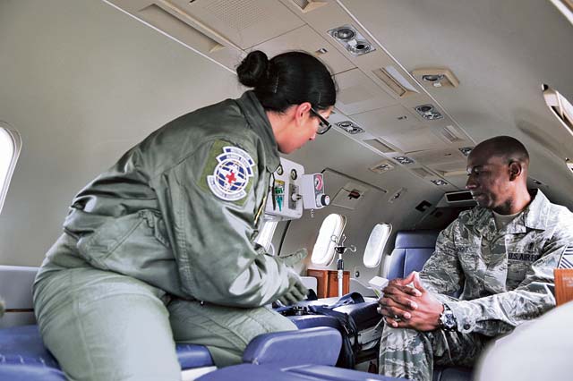 Chief Master Sgt. Kaleth Wright, 3rd Air Force command chief, talks to an 86th Aeromedical Evacuation Squadron Airman during the chief’s immersion tour March 2.