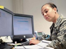 Airman 1st Class Danelle Oliver, 786th Force Support Squadron customer service technician, inputs data from base newcomer in-processing worksheets.