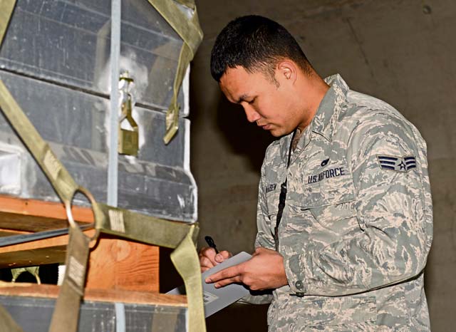 Senior Airman Christian Afaisen, 86th Munitions Squadron munitions inspector, double checks assets for correct labeling and signs of corrosion as a part of the semiannual 100 percent inspection March 16 on Ramstein. 