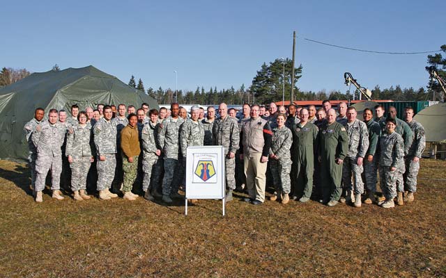 Photos by Spc. Glenn M. AndersonBrig. Gen. Arlan M. DeBlieck (middle left), commanding general of the 7th Civil Support Command, takes a moment with his entire senior staff and joint task force for a photo opportunity during Citizen Response 15 March 9 in Grafenwöhr, Germany. 