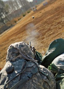 Soldiers from the 361st Civil Affairs Brigade, 7th Civil Support Command, fire an M320 grenade launcher at a combined training activity with the 173rd Airborne Brigade March 10 in Grafenwöhr, Germany.