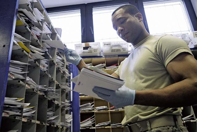 Staff Sgt. James Whyte, 86th Communications Squadron postal specialist, sorts mail in the Northside Post Office Feb. 13.  at Ramstein. The Northside Post Office is the largest Department of Defense postal operation, handling approximately 8 million pounds of mail annually. 