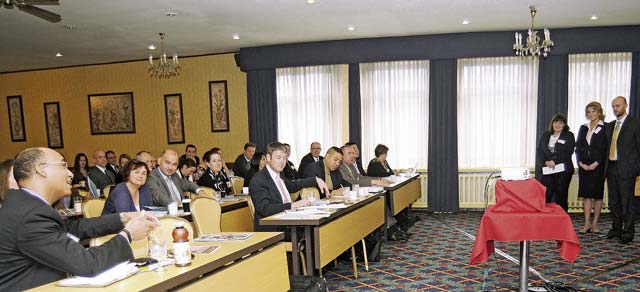 Photo by Phil A. JonesBrig. Gen. Van Coots (lower left), U.S. Army Europe Regional Medical Command commander, poses a question to Hungarian Defense Forces representatives after their presentation on “Experiences of the Williams Life Skills Training Program in the Hungarian Defense Forces.” The Feb. 25 presentation by (standing from left) Maj. Beatrix Hornyak, Lt. Col. Andrea Soter and Capt. Balazs Tapai was made during a Mental Health and Mild Traumatic Brain Injury workshop where military medical and behavioral health specialists gathered from 10 NATO countries. 