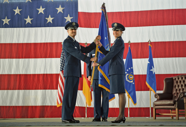 Lt. Gen. Darryl Roberson, 3rd Air Force and 17th Expeditionary Air Force commander, passes the 435th Air Ground Operations Wing’s and  435th Air Expeditionary Wing’s guidon to Col. Andra Kniep during an assumption of command ceremony March 16 on Ramstein. Kniep has  served on 13 assignments in her Air Force career and most recently served as the 23rd Fighter Wing vice commander at Moody Air Force Base, Georgia. 