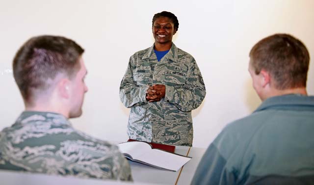 Tech. Sgt. Jessica Green, U.S. Air Forces in Europe and Air Forces Africa surgeon general resource adviser, laughs while listening to Airmen during a leadership management class for junior Airmen March 6 at Ramstein.