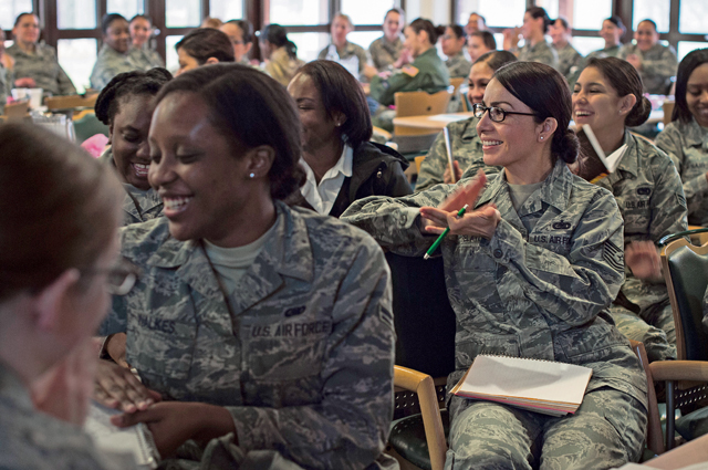 Military members applaud a speaker during a seminar hosted by the “Let’s Connect” group  March 10 at Ramstein. More than 70 women had the opportunity to talk to one another about topics including leadership, followership and balancing life and work. They also  observed Women’s History Month, remembering the many achievements women have accomplished.