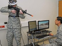 Photo by Phil A. JonesA behavioral health specialist aims his weapon during a demonstration provided by Maj. (Dr.) Michael Valdovinos to show how Virtual Reality Exposure Therapy can be used to treat Post-Traumatic Stress Disorder.