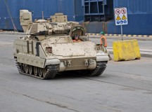 Photo by Staff Sgt. Warren W. Wright Jr.Soldiers from the 3rd Infantry Division move an M1A2 Abrams Main Battle Tank immediately after its removal from the transportation vessel “Liberty Promise” March 9 at the Riga Universal Terminal.