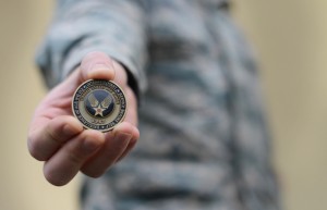 Photo by Airman 1st Class Deana Heitzman The Airman’s coin signifies the beginning of an enlisted member’s career upon graduating basic military training. The original version of the Airman’s coin featured an eagle clawing its way out of the coin with the words “Aerospace Power” under it. The most recent coin replaced the eagle with the new Air Force symbol. 