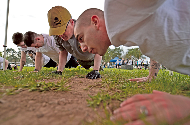 Airmen perform during a push-up competition. 