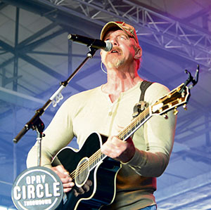 Country music singer Trace Adkins performs during a USO concert. The concert was free for all Department of Defense ID cardholders and was in honor of the Grand Ole Opry’s 90th anniversary.