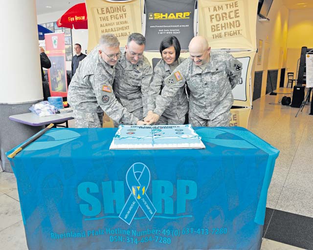 (From Left) Col. Shawn Wells, Brig. Gen. Patrick X. Mordente, 86th Airlift Wing commander, U.S. Army Garrison Rheinland-Pfalz commander, Chief Master Sgt. Joanne Bass, 86th Operations Group superintendent and Col. Barry Diehl, USAG Rhein- land-Pfalz deputy commander, cut a cake at the Sexual Assault Aware- ness and Prevention Month kickoff event April 1 at the  Kaiserslautern Military Community Center food court and included speakers and key leaders on hand for discussion. 