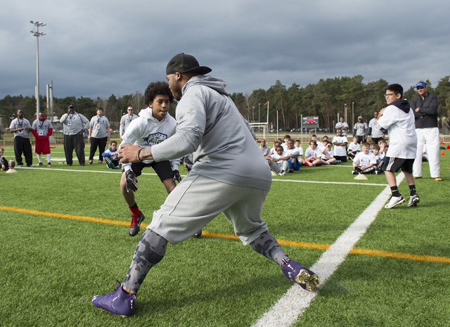 Amare Francois, son of Jennifer Colbert, guards Steve Smith, Baltimore Ravens wide receiver, during the  ProCamps event. Francois successfully stopped Smith from catching the ball.