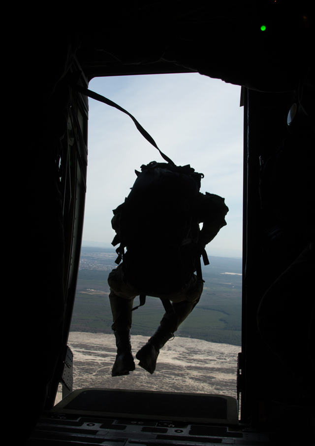 Polish air force paratroopers jump from a C-130J Super Hercules assigned to the 37th Airlift Squadron during training.