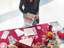 Gabriella Wells, military spouse, asks questions about education programs at the University of Oklahoma table at the 86th Force Support Squadron Ramstein Education Center Education Fair, held at the Kaiserslautern Military Community Center food court at Ramstein Air Base, Germany, April 16, 2015. Wells heard about the fair on the radio and came to find out more information about pursuing an advanced degree in strategic communication.