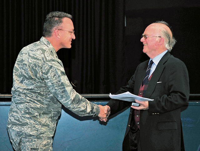Brig. Gen. Patrick Mordente, 86th Airlift Wing commander, shakes hands with Friedrich Wilhelm von Hase, son of German army Lt. Gen. Paul von Hase, during a Holocaust Remembrance Day ceremony.