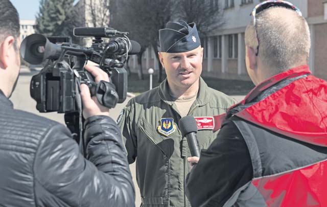 Lt. Col. David Berkland, 480th Fighter Squadron commander, is interviewed by local media during Dacian Warhawk, a bilateral training event designed to increase interoperability and build relationships between Romanian and U.S. Airmen.