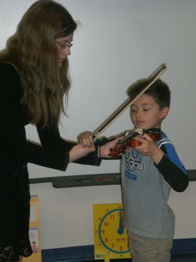 After the concert, Johanna Hentschel from the Kaiserslautern Orchestra visited teacher Ahola's second-grade classroom at Landstuhl Elementary Middle School and allowed Liam Delao to play the violin. 
