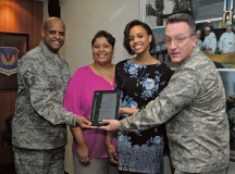 Photo by Senior Airman Timothy Moore
RianSimone Harris receives the 2015 European Military Youth of the Year award from Brig. Gen. Patrick X. Mordente, 86th Airlift Wing commander, March 30 on Ramstein. Pictured with Harris are her parents Tatineesha and Master Sgt. Shaun Harris, 435th Security Forces Squadron first sergeant.