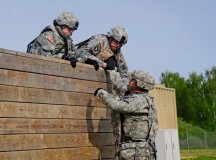 Photo by Staff Sgt. Warren W. Wright Jr.
Best Warrior candidates work as a team to navigate a wall obstacle May 12 during the medical simulation portion of the 2015 Best Warrior Competition held May 10 through 14 at Camp Aachen. First-place warriors in junior officer, noncommissioned officer and junior Soldier categories will compete in the U.S. Army Europe BWC.