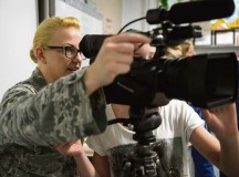 Senior Airman Lindy Pata, American Forces Network Kaiserslautern broadcaster, teaches children from Ramstein Intermediate School about her career April 28 on Ramstein.