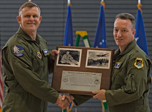 Gen. Frank Gorenc, U.S. Air Forces in Europe and Air Forces Africa commander, presents Brig. Gen. Patrick X. Mordente, 86th Airlift Wing commander, with the Lt. Gen. William H. Tunner Trophy for demonstrating a culture of innovation and winning the inaugural Innovation Madness tournament May 1 on Ramstein.