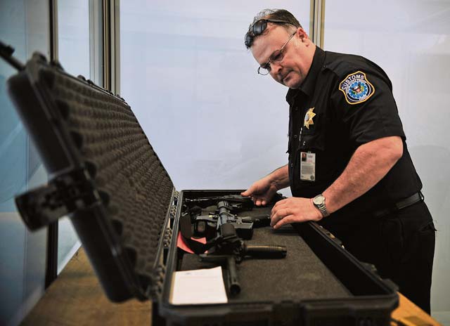 Ricky Shepherd, U.S. Army Customs Europe customs inspector, examines a passenger’s weapon case in the Ramstein Passenger Terminal April 14 on Ramstein. Customs members search baggage for prohibited items such as drugs, meats, cheeses and unauthorized weapons.
