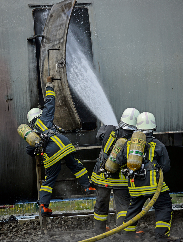 Lithuanian air force firefighters prepare for a simulated aircraft fire during a NATO Firefighter Fundamentals course May 20 on Ramstein.