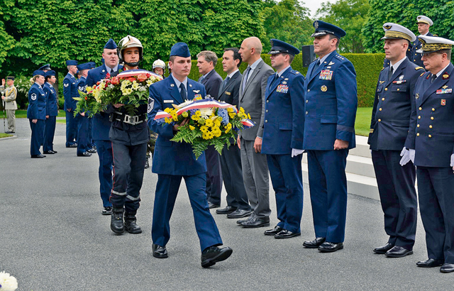 Wreaths are presented to be laid during a Memorial Day ceremony May 24, 2015, at St. Mihiel American Cemetery in Thiaucourt, France. The ceremony was one of many held throughout Europe during Memorial weekend to honor the sacrifices of fallen American servicemembers.