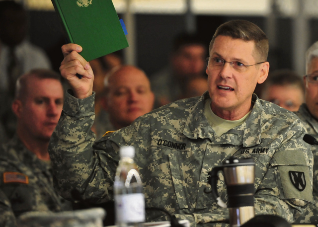 Maj. Gen. John R. O’Connor, commanding general of the 21st Theater Sustainment Command, reads an excerpt explaining the importance of logistics during the 21st TSC hosted table-top exercise May 27.